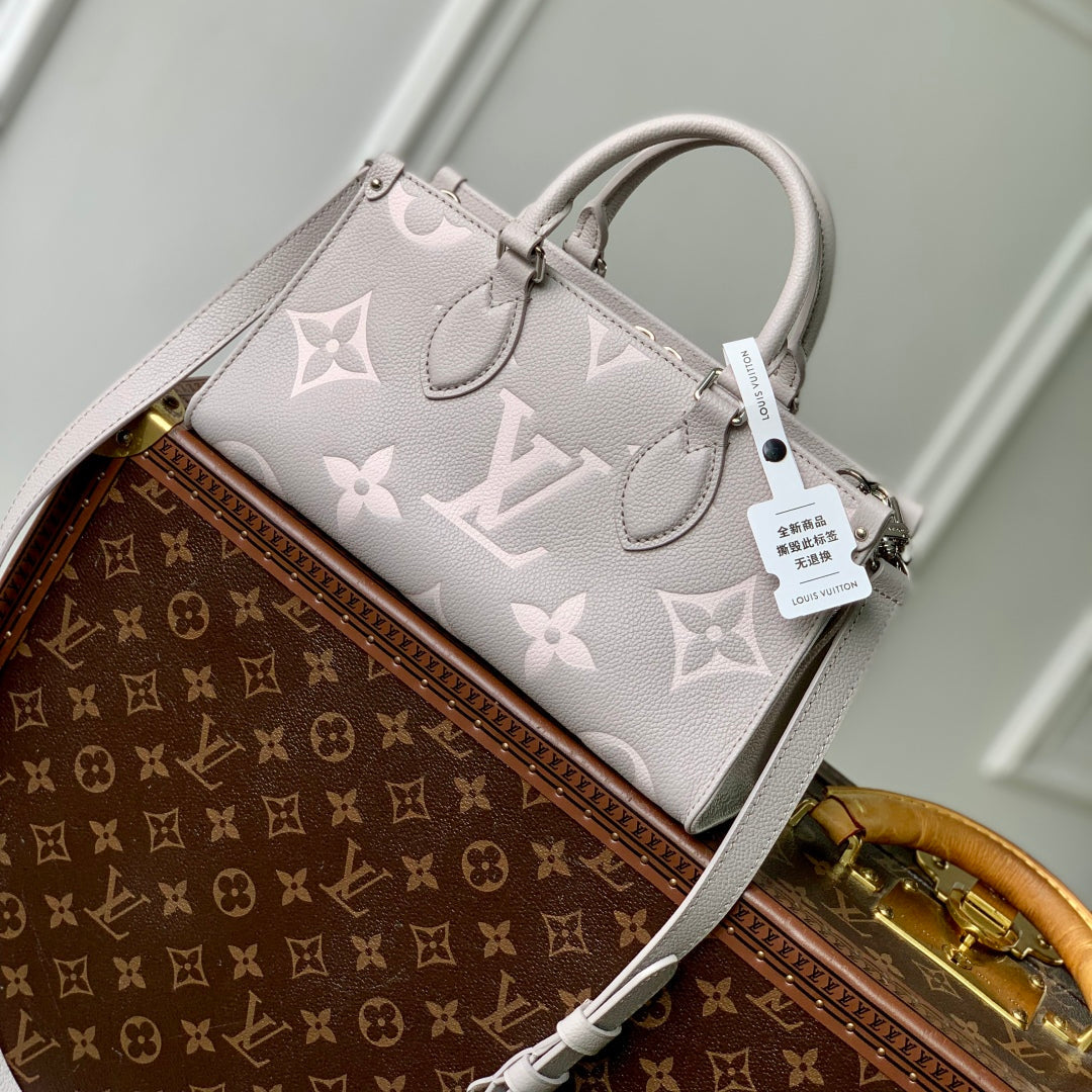 LOUIS VUITTON ONTHEGO EAST WEST BAG 25 IN BICOLOR MONOGRAM EMPREINTE LEATHER