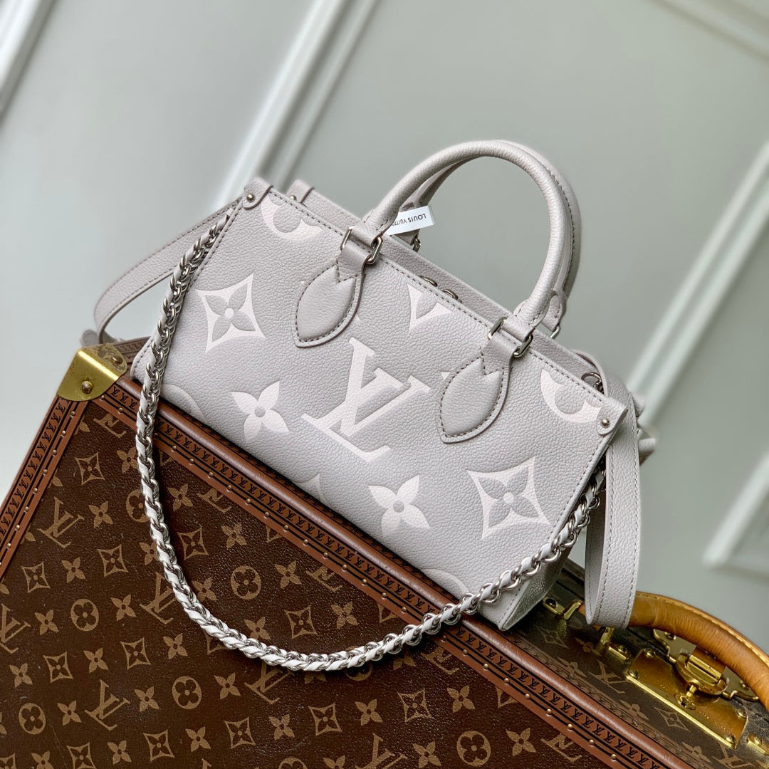 LOUIS VUITTON ONTHEGO EAST WEST BAG 25 IN BICOLOR MONOGRAM EMPREINTE LEATHER