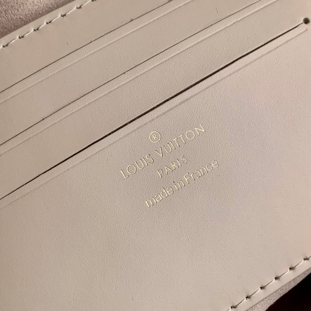 LOUIS VUITTON WALLET ON CHAIN IVY 23 IN BEIGE MONOGRAM REVERSE CANVAS EMBOSSED LOGO