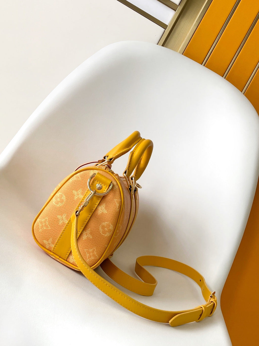 LOUIS VUITTON KEEPALL BANDOULIÈRE 25 IN ORANGE MONOGRAM HERITAGE CANVAS