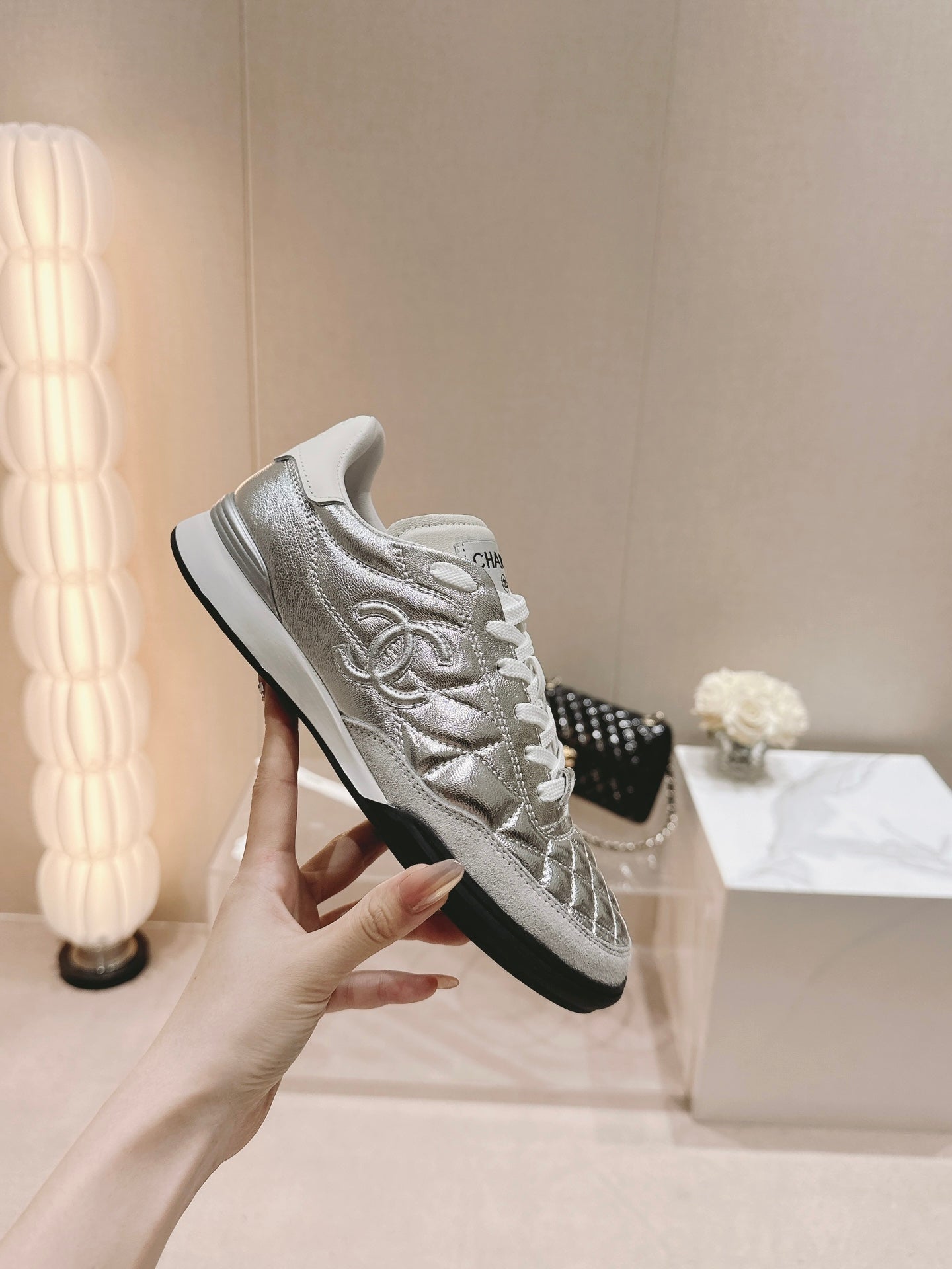CHANEL SNEAKERS IN GLOSSY SILVER LAMBSKIN