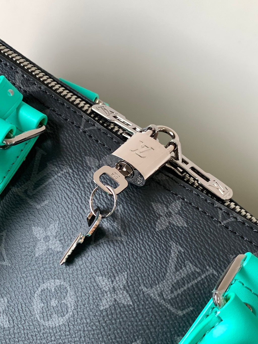 LOUIS VUITTON LV 25S KEEPALL 50 WITH SHOULDER STRAP IN BLACK AQUA COATED MONOGRAM ECLIPSE CANVAS AND CALFSKIN