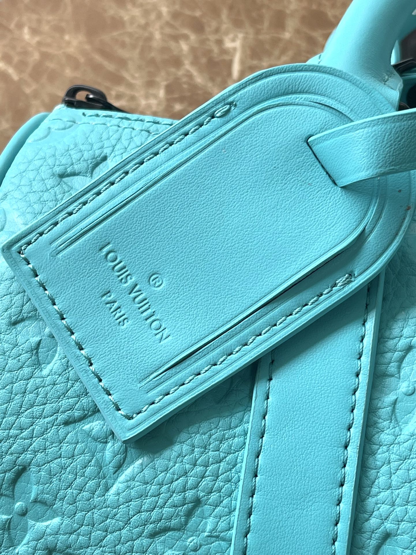 LOUIS VUITTON KEEPALL BANDOULIÈRE 25 IN TURQUOISE BLUE MONOGRAM EMBOSSED CALFSKIN