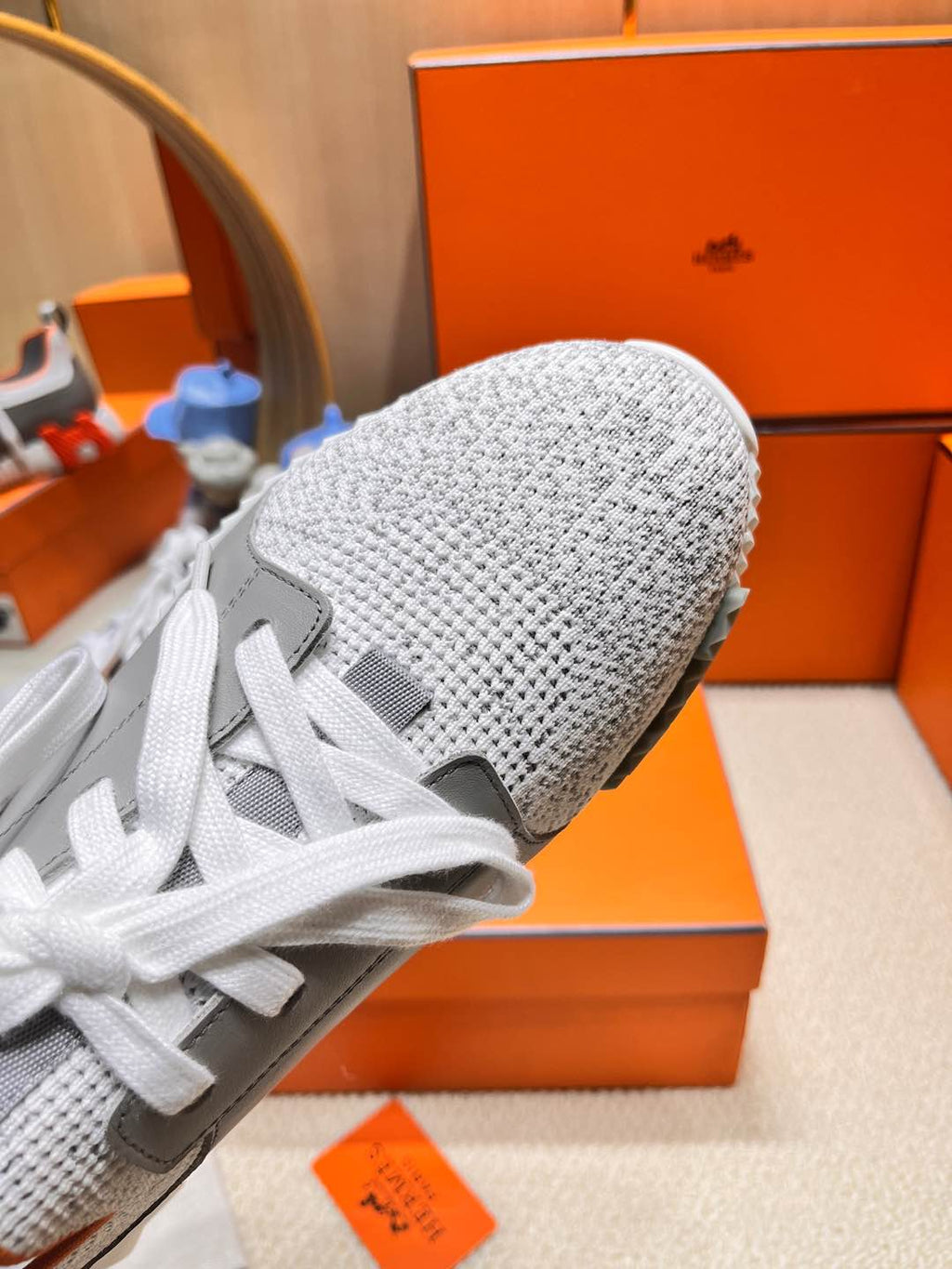 HERMES DEPART SLIP-ON SNEAKER IN WHITE MIX MOUSE GRAY KNIT AND CALFSKIN