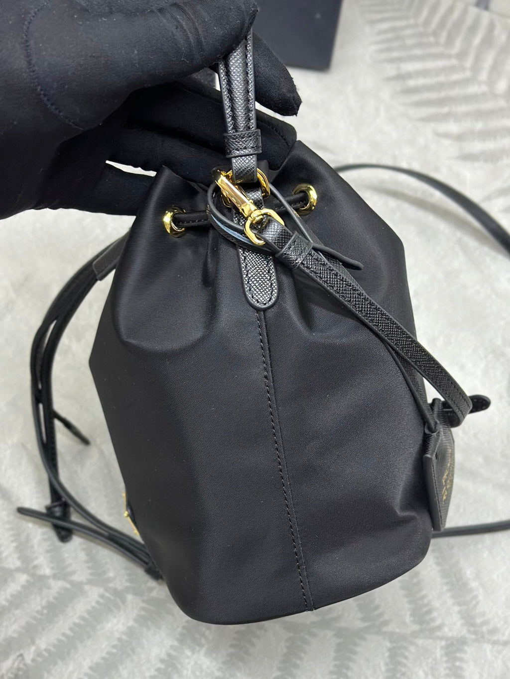 PRADA BUCKET BAG 19 IN BLACK RE-NYLON AND CALFSKIN HANDLE